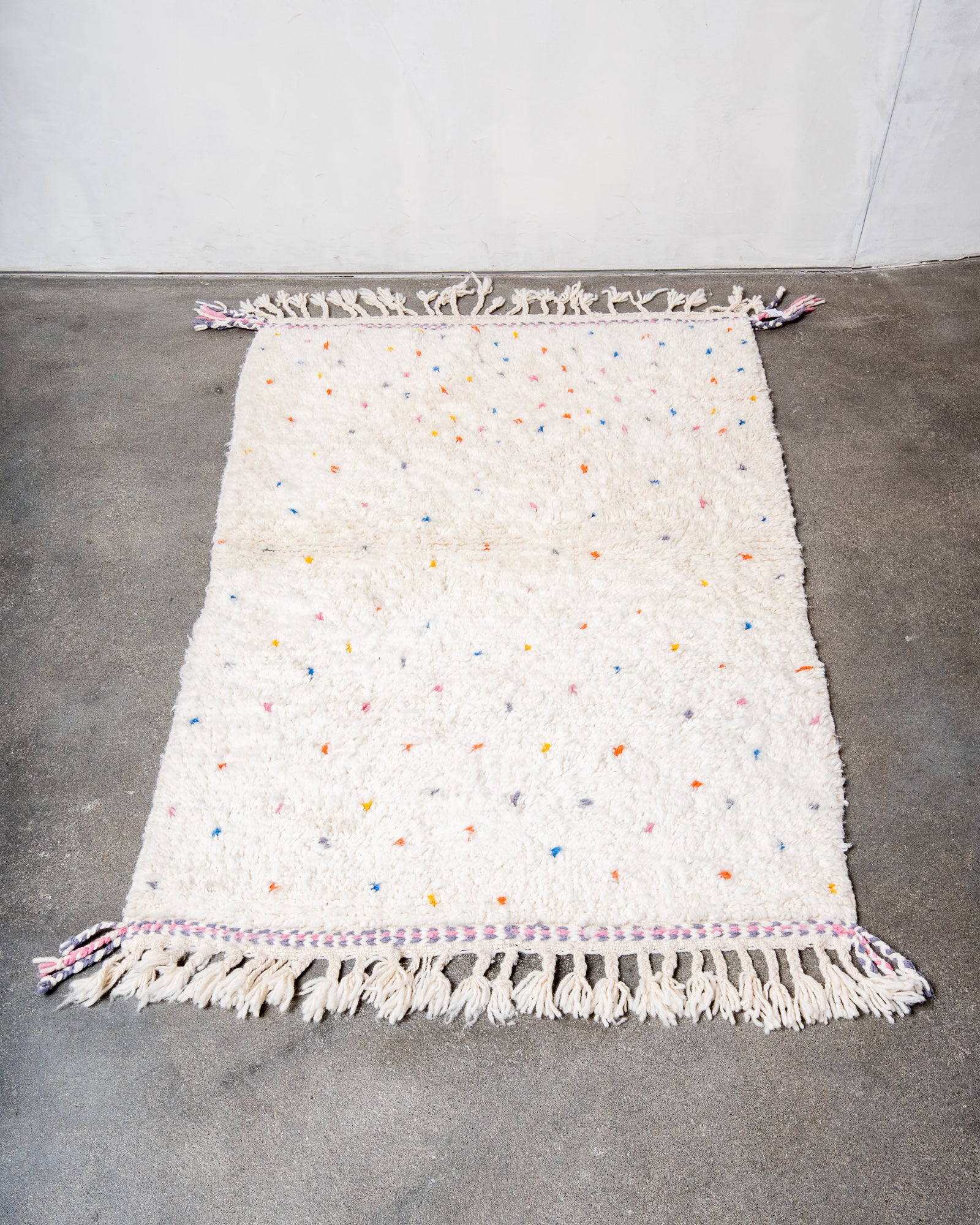 Modern, designer, handcrafted Berber rug from Morocco. Beniourain carpet with beautiful colours and patterns and fluffy wool texture.